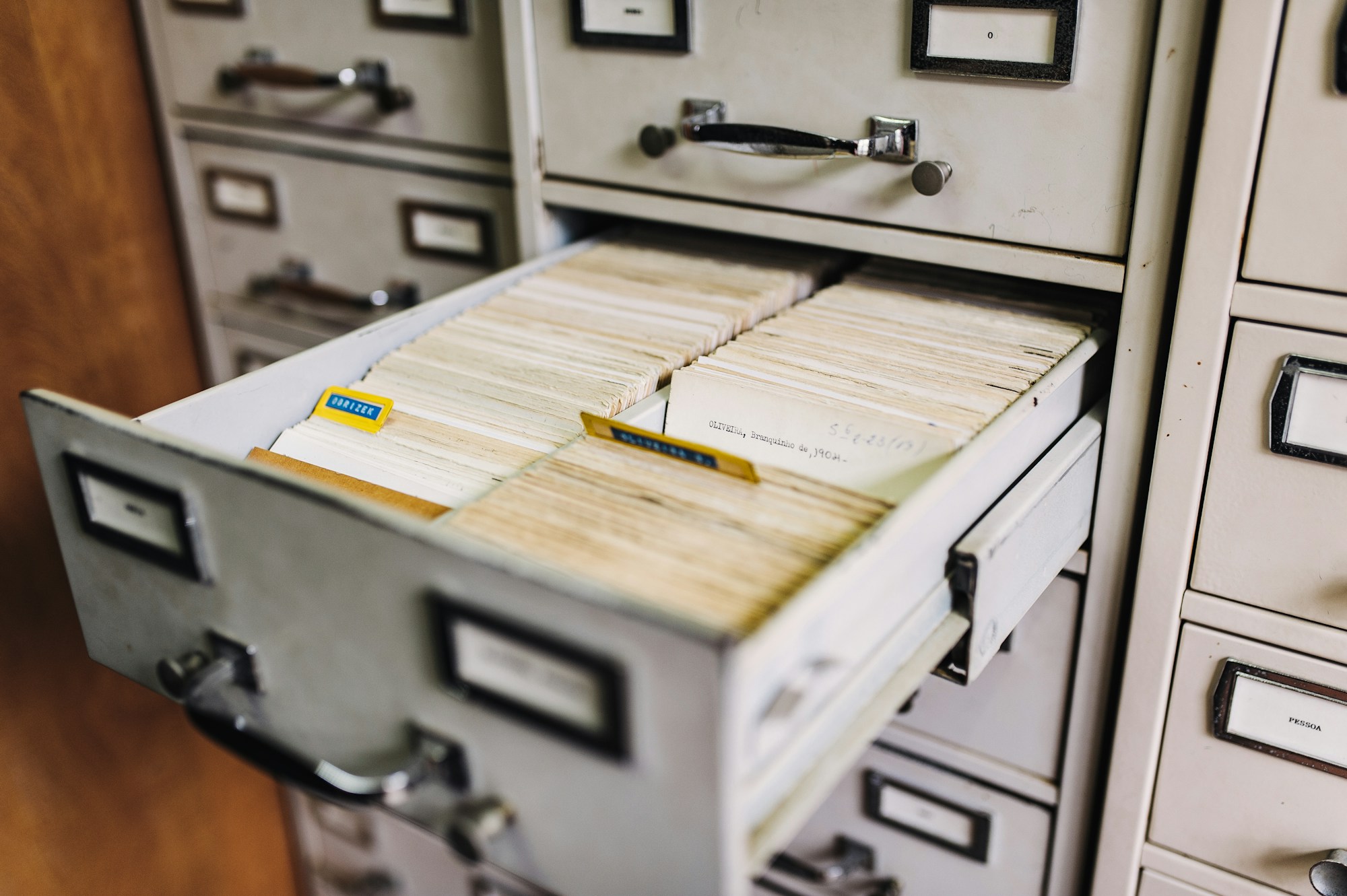 Illustrative photograph of an open filing cabinet with paper records